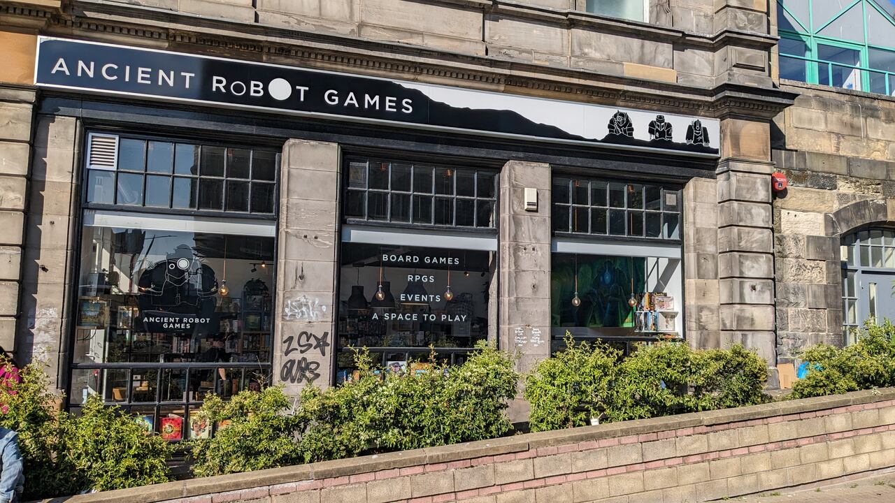 Side wall of Ancient Robot Games showing the large windows and the sign