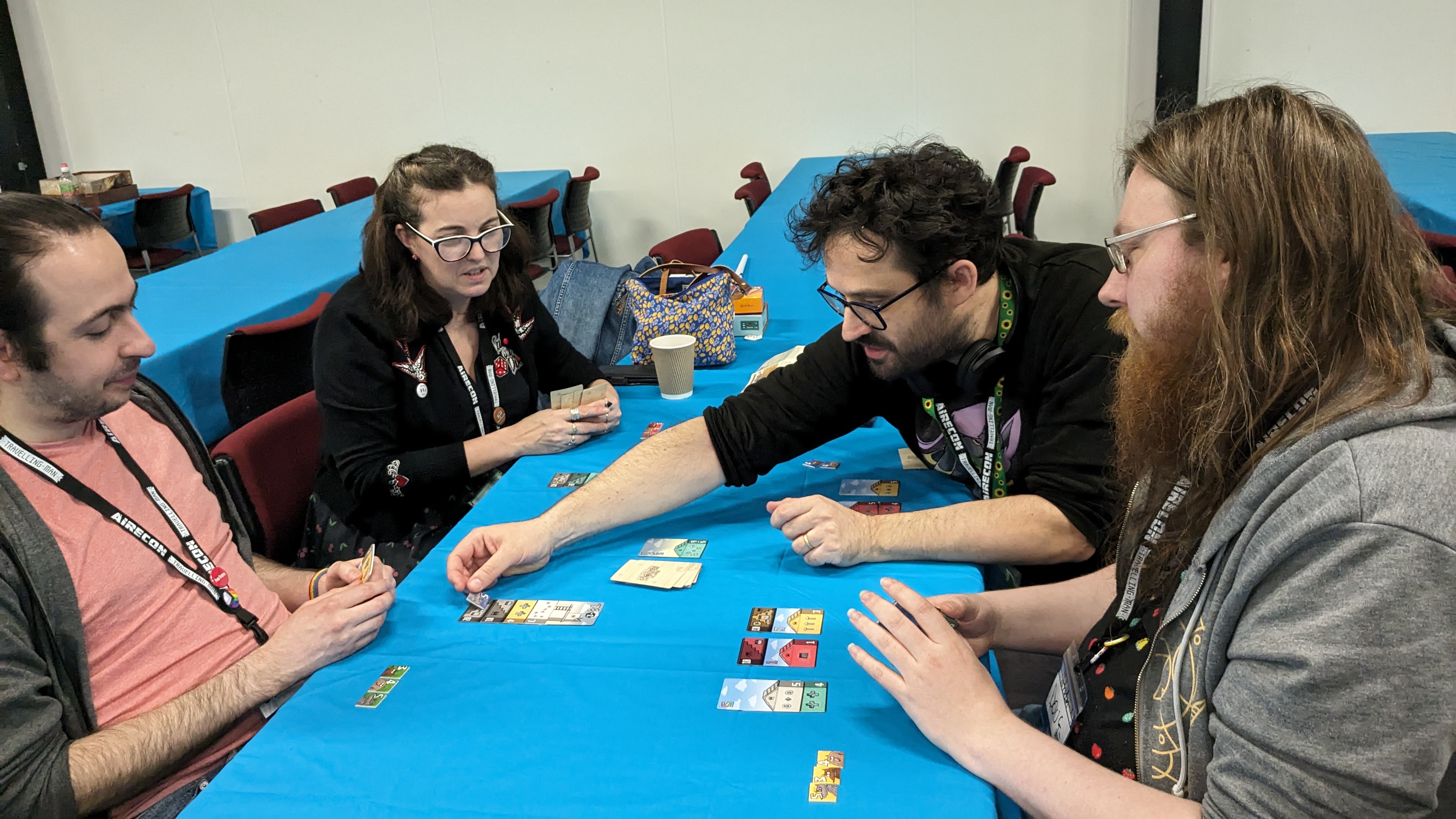 Ann, Tim, Doug, and Sam playing a game about pigs and wolves.
